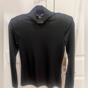 Black turtleneck with shoulder pads